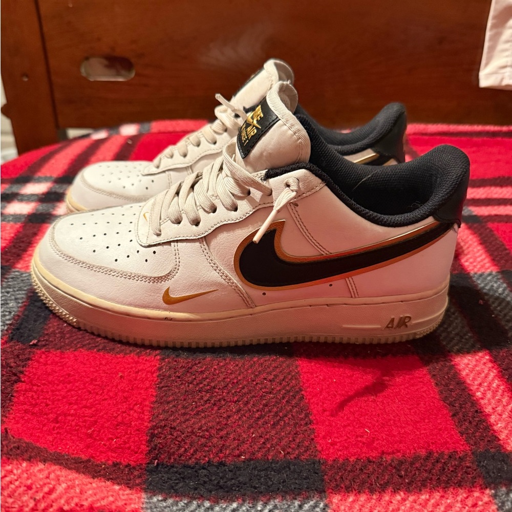 Nike Kids White Sneakers with Black and Gold Accents